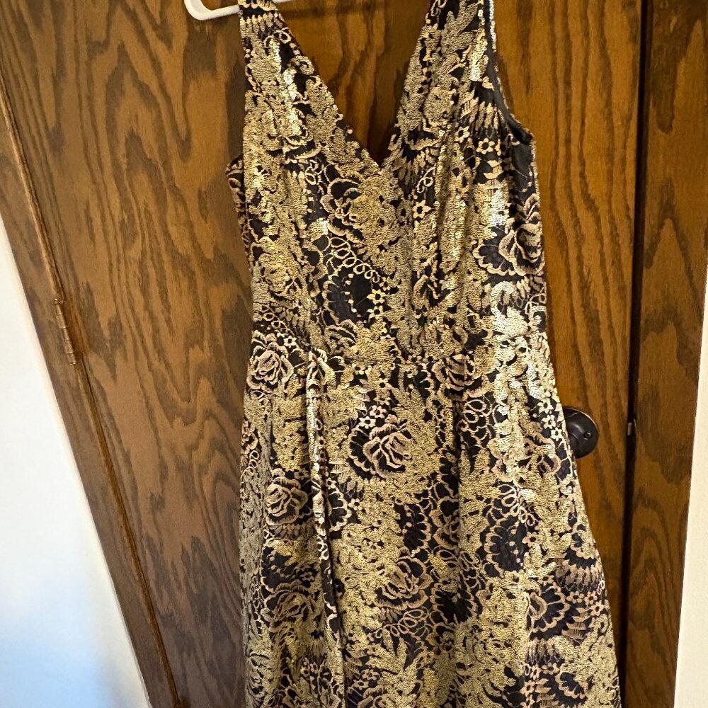 Black and gold sequin gown